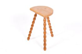 A vintage French bobbin turned three legged beech stool.