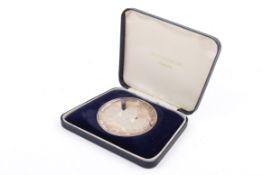 A 'Man's First Moon Landing', limited edition commemorative silver medallion.