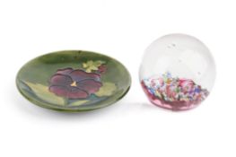 A 20th century Moorcroft pin dish with pansy decoration along with a Cathness glass paperweight,