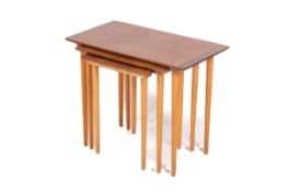 A Norwegian mid-century nest of tables by Torpe Mobelfabrikk. Teak tops on tapering beech legs.