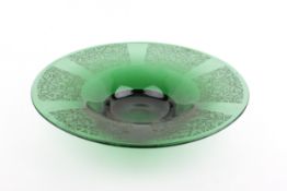 A large vintage green glass dish on step base.