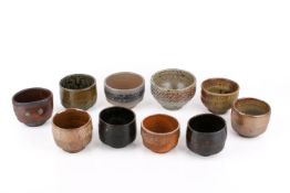 A collection of ten mid-century textured studio pottery stepped bowls.