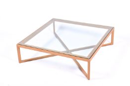 A Knoll 'Krusin' light oak coffee table with thick, clear glass top, retailed by Heals.