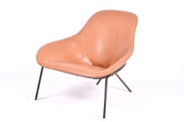 A Conran 'Magnus' cross leg lounge chair in cognac leather.