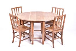 A circa 1930s Arts and Crafts, limed oak table and four chairs by Rowley, in the manner of Heals.