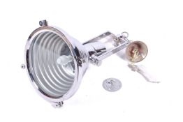 A large, industrial, vintage style polished metal ceiling lamp. Fittings present.