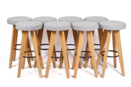 Eight retro style modern bar stools.