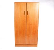 A mid-20th century G-Plan, E Gomme light oak wardrobe.