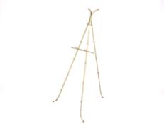 A 1930's simulated bamboo metal easel. Pale green painted finish with hinged back.