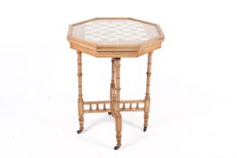 Chess board top game table on a cross-frame stand.