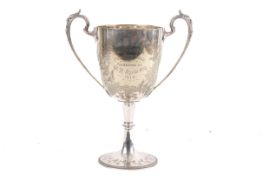 A 1910 Bridgwater Poultry Show silver plate twin handled trophy.