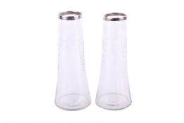 A pair of early 20th century silver mounted glass vases.