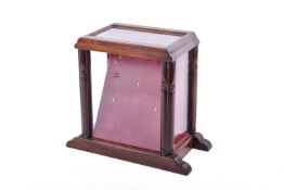 A mahogany glazed pocket watch display cabinet.