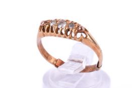 A partially hallmarked 18ct gold and diamond ring. Set with three mixed old cut diamonds of 0.