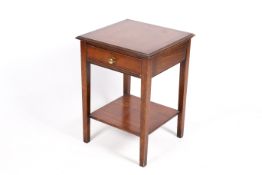 A contemporary mahogany side table. Having a drawer and lower shelf.