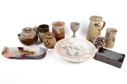 A collection of assorted studio art pottery items. Including a tea pot, jugs and a sheep, etc.
