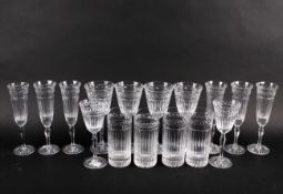 A set of cut glass crystal drinking glasses. Including champagne flutes, etc.