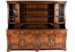 A large early 20th century oak dresser in two sections.
