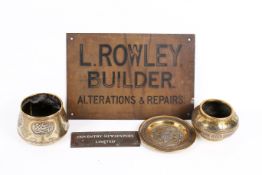 A group of five assorted metalware. Including two brass company signs and three Islamic bowls.