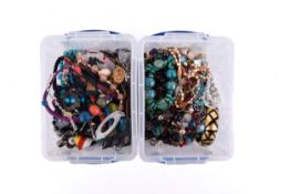 Two tubs of assorted costume jewellery.