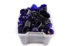 A collection of assorted blue glass condiment liners. Various sizes and shapes.