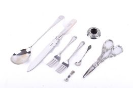 A small group of assorted silver mounted and white metal items.
