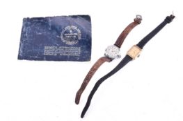 A 9ct gold lady's quartz wristwatch and a stainless stell example.