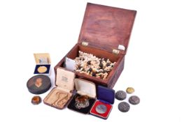 A wooden box of costume jewellery and collectables.