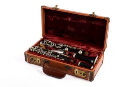 An early 20th century French clarinet by Paul Renne of Paris, cased.