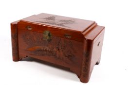 Chinese carved camphor wood chest having hinged cover. Carved boat decoration.