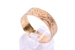 An 18ct gold band ring.
