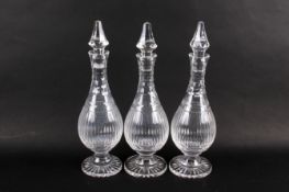 Three Stewart Crystal Senator pattern glass decanters with stoppers.