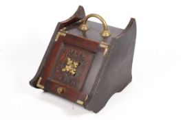 A Victorian mahogany and brass coal box purdonium.