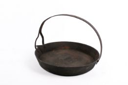 A vintage cast iron 'Romanie Gypsie' frying pan. With strap handle.