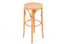A 20th century Thonet style bentwood bar stool.