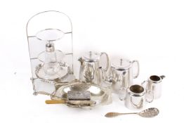 A group of assorted silver plate. Including a cake stand, three piece tea set, etc.