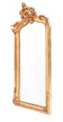 An ornate Mid Georgian style bevelled wall mirror with high relief gilt gesso frame.