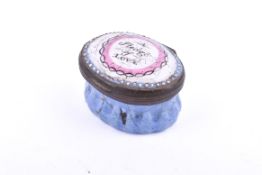 A 19th century enamel patch box. Reading 'A Pledge of Love' to the lid, mirror to the inside, W3.