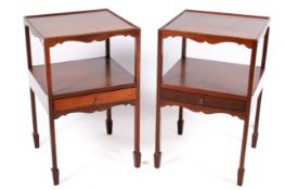 A pair of 20th century Georgian style mahogany nightstands.