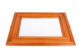 A 20th Century oak mirror with moulded frame.