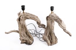 A pair of contemporary driftwood style resin table lamps.