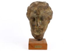 A patinated plaster Classical Greek style bust of Hygeia.