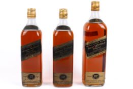 Three vintage 12 years old bottles of Johnnie Walker Black Label whisky. Two 750ml and one 1 litre.