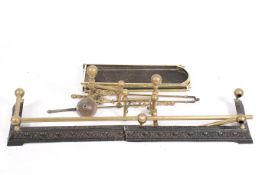 A group of assorted brass fire side items.