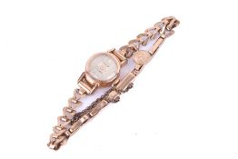 A vintage lady's gold plated cocktail watch with a 9ct bracelet strap.