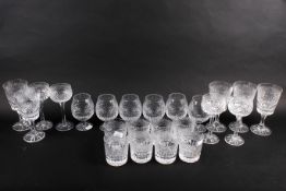 A set of cut glass crystal drinking glasses. Including tumblers and brandy, etc.