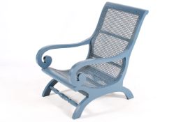 A blue painted, vintage style, colonial planters chair with scroll arms and cane seat.