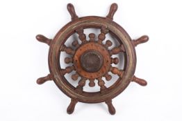 'Arabic Dowel' ship's wheel, with turned mahogany handles.