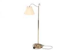 A brass adjustable standard lamp.