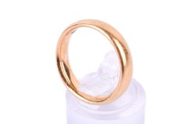 A 22ct gold wedding band. Size M, weight 7.2g.
